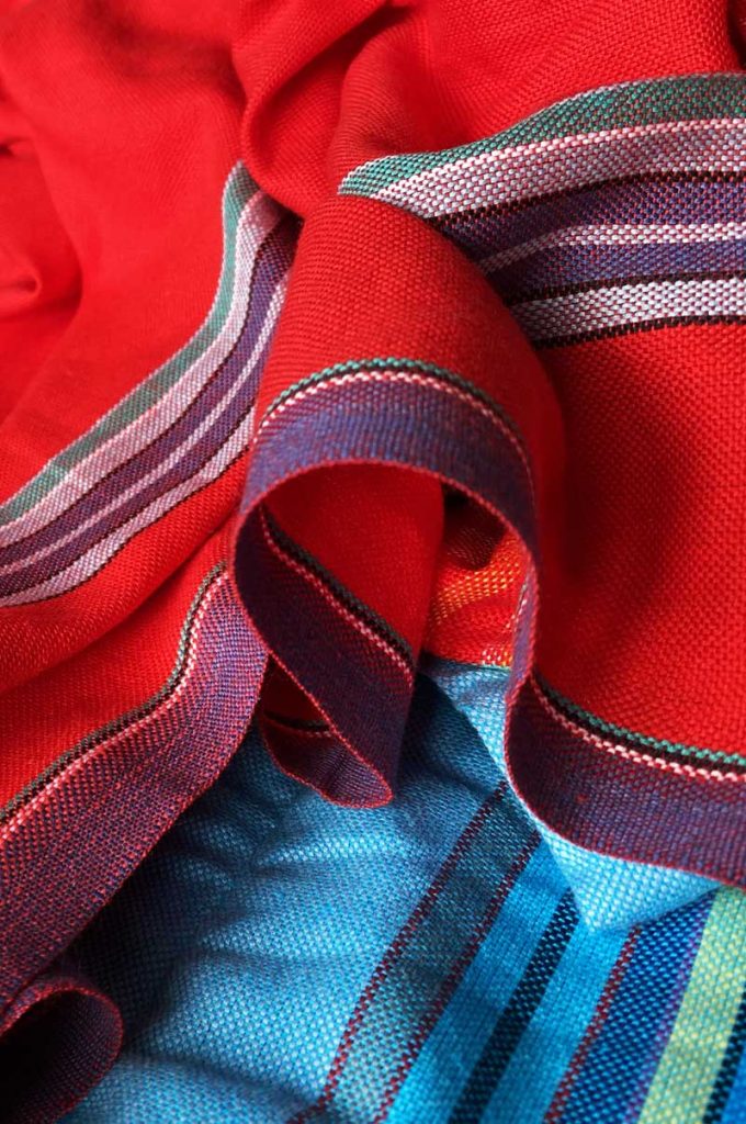 A red and blue material scarf