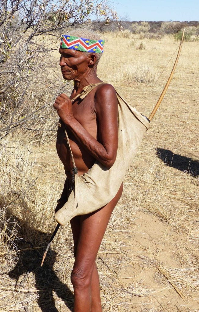 An elderly San Bushman with a bow and arrow, Namibia