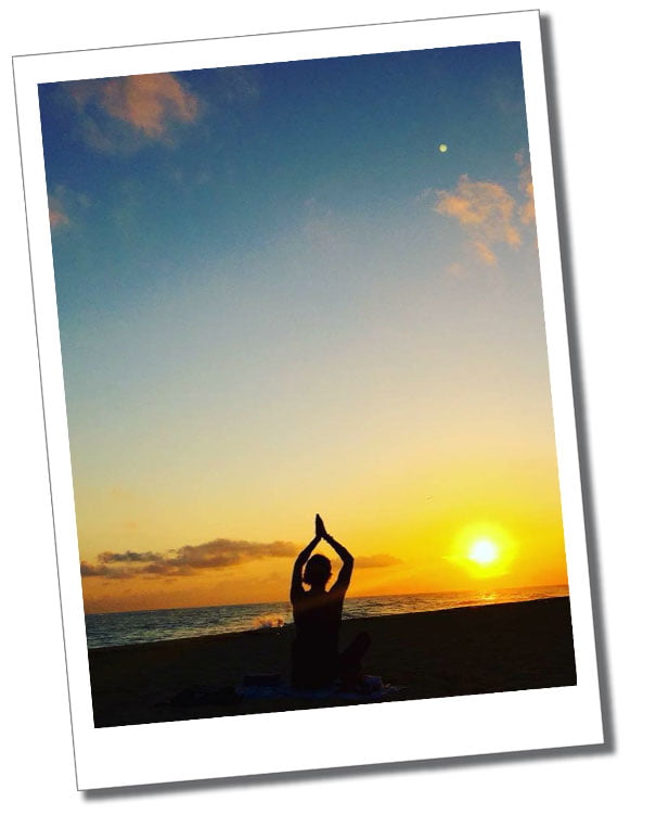 SueWhereWhyWhat strikes a yoga pose at sunrise on the beach in Cuba.