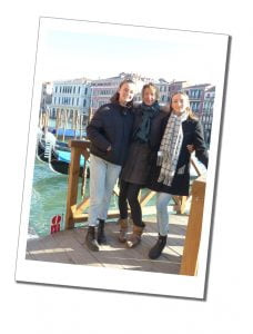 SueWhereWhyWhat and nieces on a bridge in Venice Italy standing in front of Gondolas