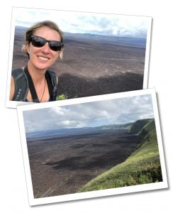 SueWhereWhyWhat smiling in sun glasses, standing at the edge of the enormous crater of Isabela-Sierra-Negra-Volcano, The Galápagos Islands. The Best 8-Day Boat Tour Of The Galápagos Islands