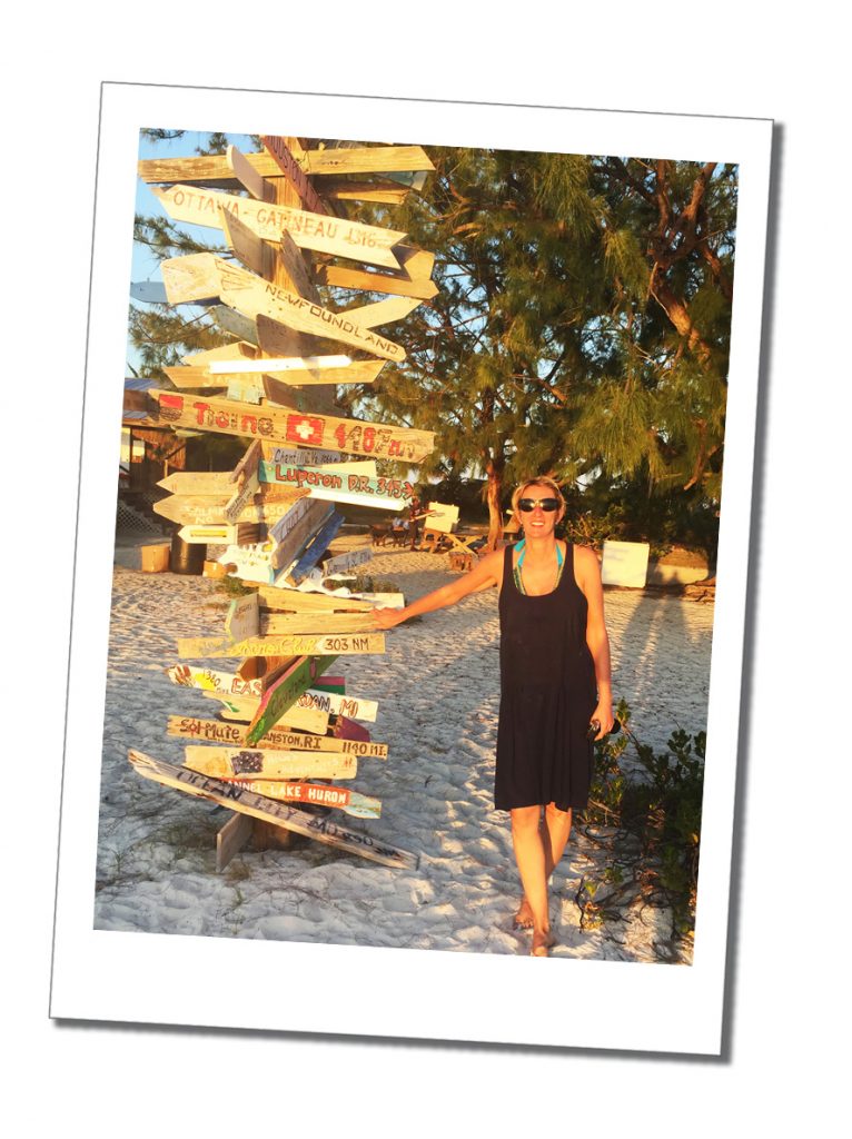 SWWW on the beach by big wooden sign post Stocking Island