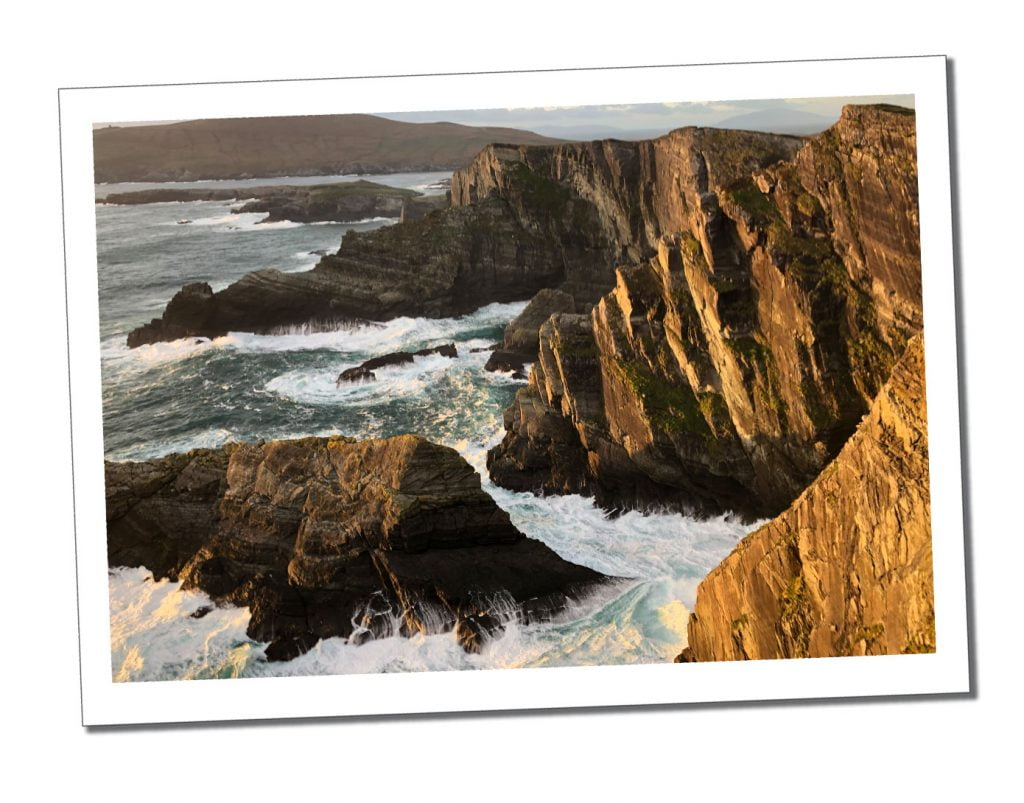 Dramatic jagged Cliffs are buffeted by huge foamy waves on Ireland’s Beautiful Wild Atlantic Way in 5 Days – Kerry & Cork