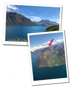 View of blue lakes and mountains from an aeroplane arriving in Queenstown, New Zealand