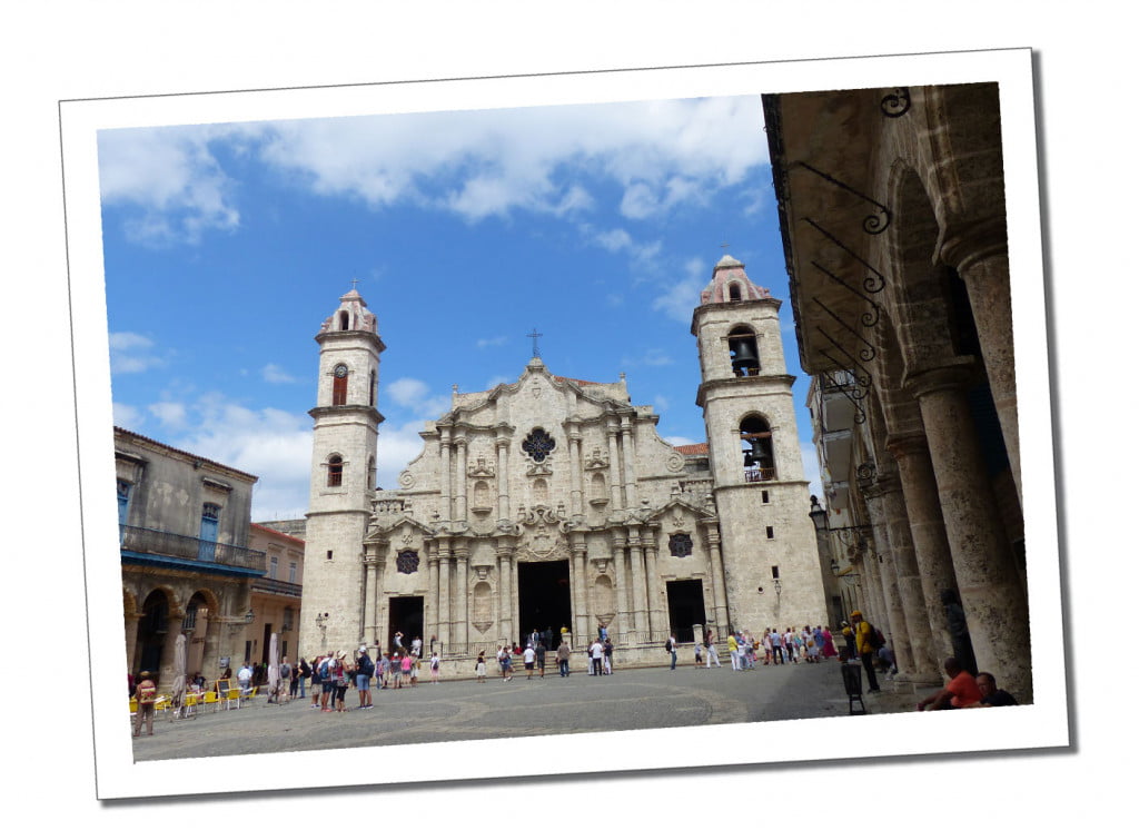 A large white church, with milling tourists in the Central Square of Havana
