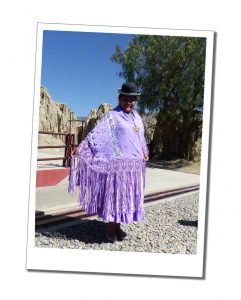 A bowler hat wearing Cholita in national costume, Lake Titicaca, Peru