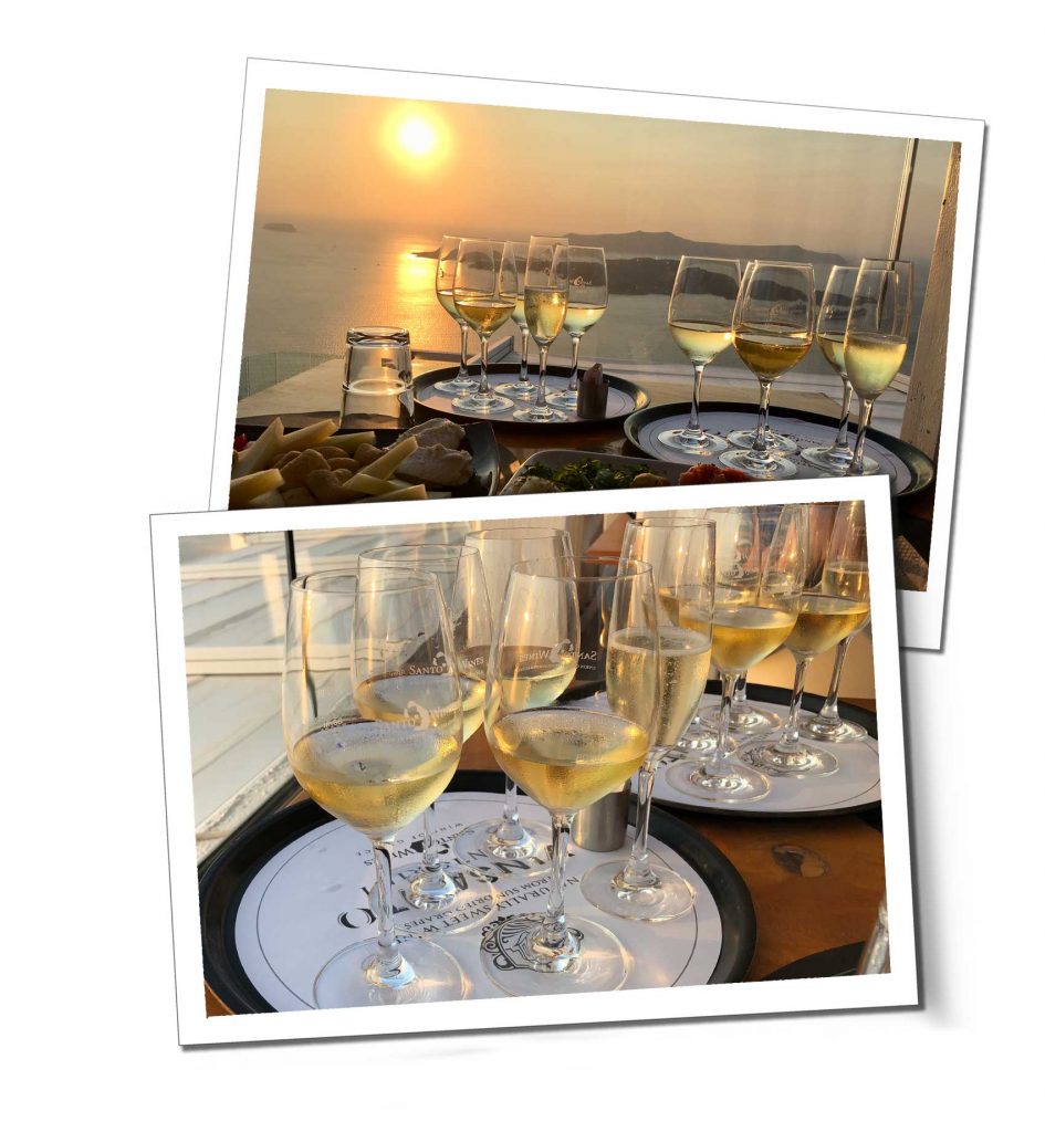 A tray of varying sized wine glasses on a table overlooking a dusky seascape