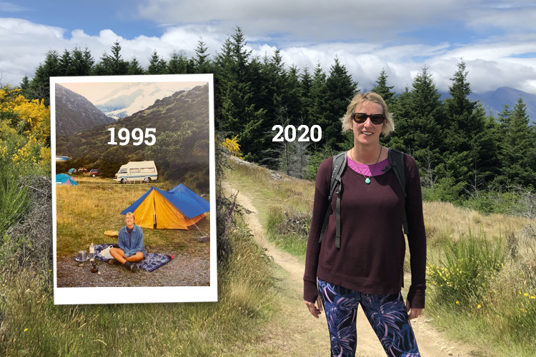 A Woman in sunglasses and purple jumper standing on a hillside path with the number 2020 next to her in a white text overlay with a small picture of a tent with a text overlay saying 1995