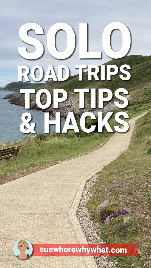 A concrete path running along a headland leading to heather clad hills with a large white text overlay