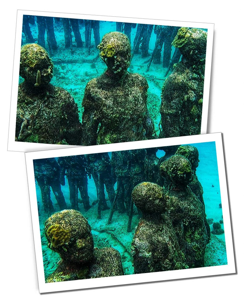 A ring of sculptures depicting stone people standing in a ring in an underwater scene in Grenada