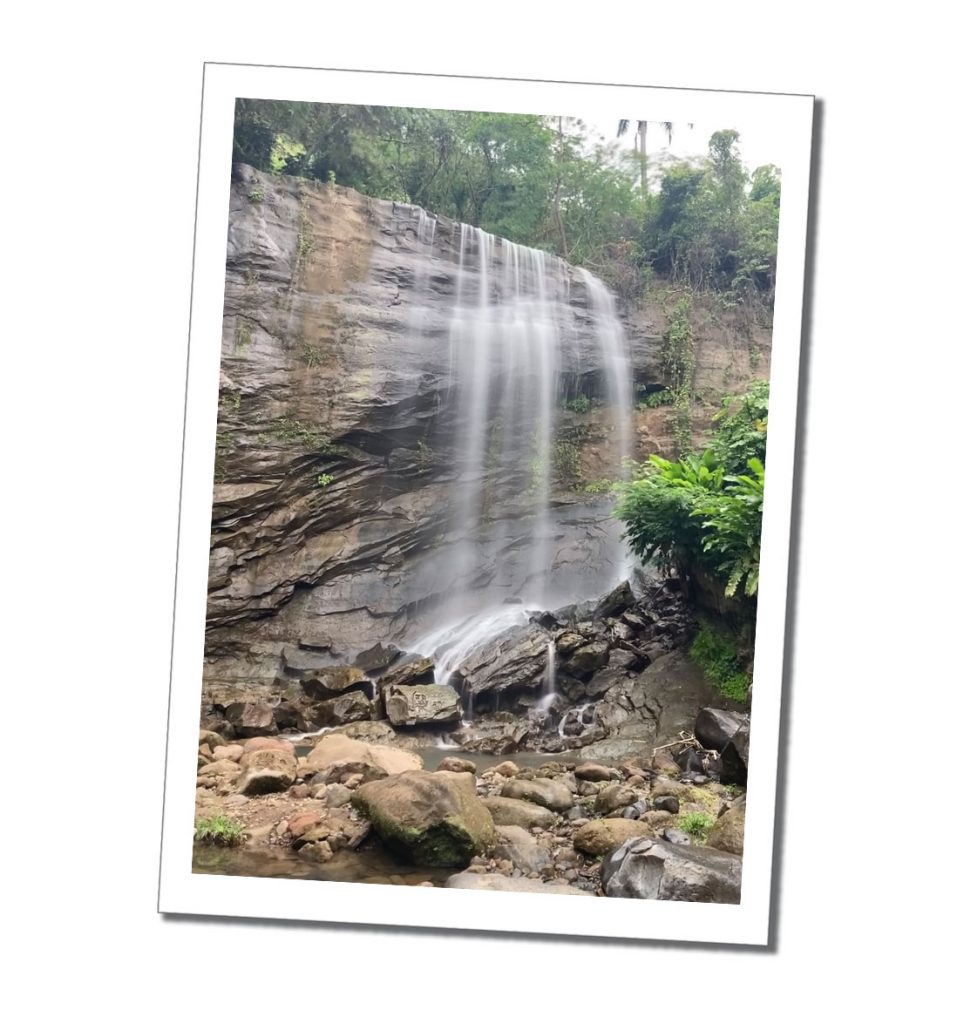 A cascading waterfall down a rock face