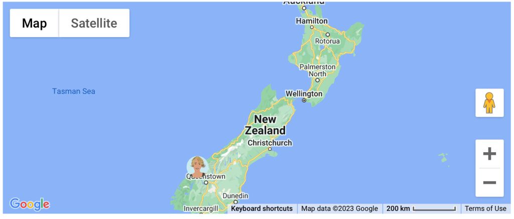 A map of New Zealand with an avatar of blonde woman stuck over the word Queenstown
