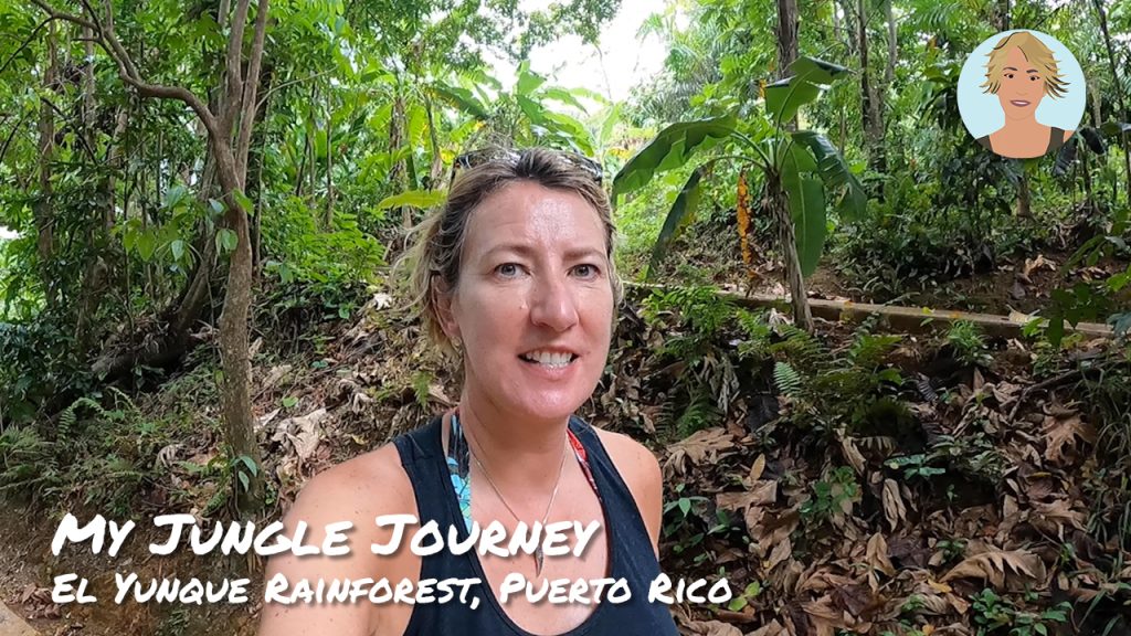 A Blonde woman in a vest walking through a lush jungle