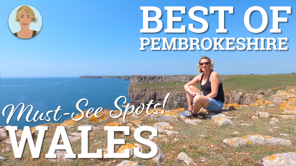 A blonde woman in sunglasses sitting cross legged on the cliffs over looking a deep blue sea