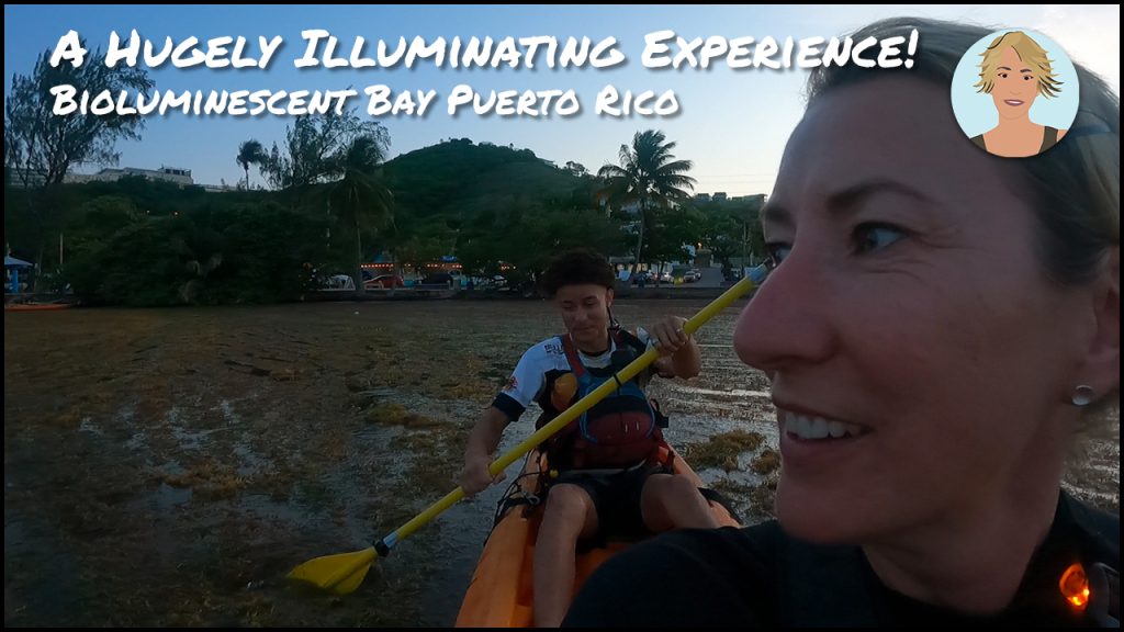 A blonde woman and a man in a kayak at dusk