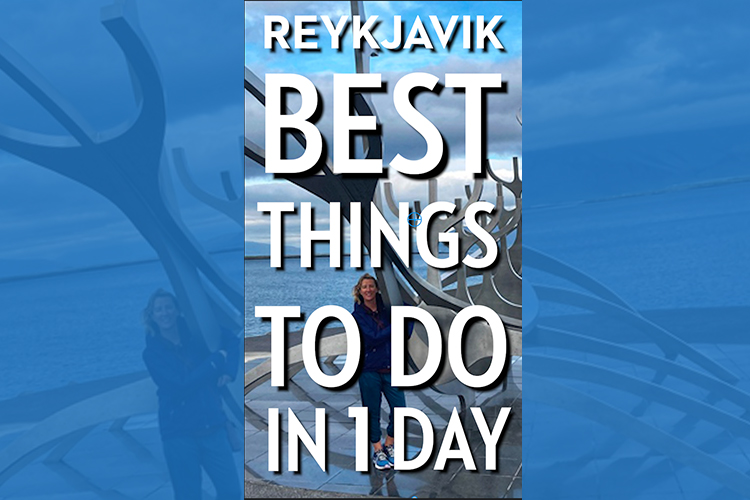 A Woman standing in front of a large metal viking ship sculpture