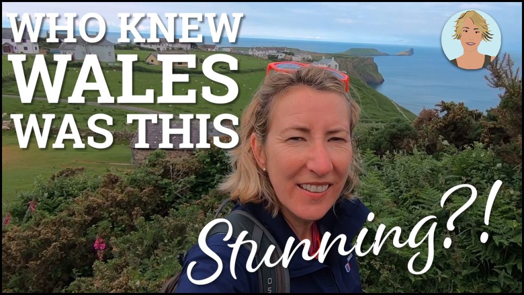 A blonde woman smiling on the cliff above the sea