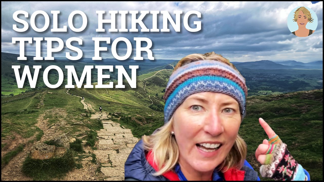 Smiling Woman in a headband pointing to vast green holy landscape